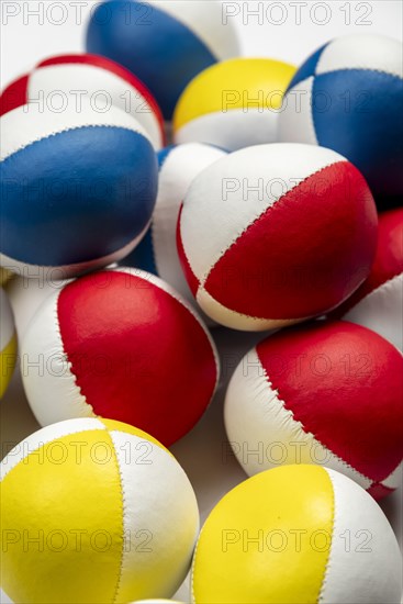 Colourful juggling balls, white behind, as background, studio shot, Germany, Europe