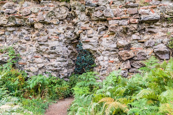 Interior stone and brick wall of castle ruins with with opening for egress in Istanbul, Tuerkiye