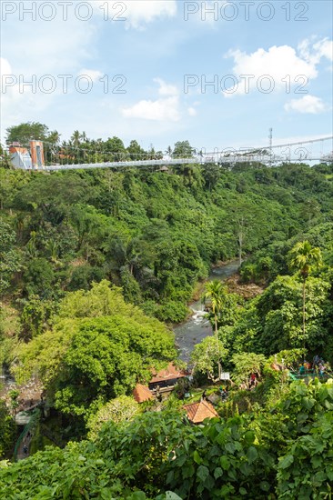 Bridge near Tegenungan waterfall, Bali island, Ubud, Indonesia. Jungle, tropical forest, daytime with cloudy sky