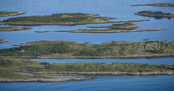 Rocky islands in the blue sea, sea with archipelago islands, Ulvagsundet, Vesteralen, Norway, Europe