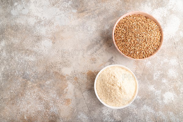 Powdered milk and buckwheat baby food mix, infant formula on brown concrete background. Top view, flat lay, copy space, artificial feeding concept