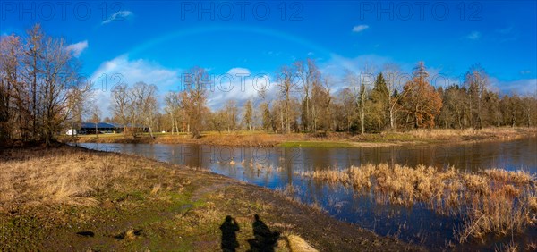 Rainbow over the source of the Danube, the confluence of the Breg and Brigach rivers to form the Danube, Donaueschingen, Baden-Wuerttemberg, Germany, Europe