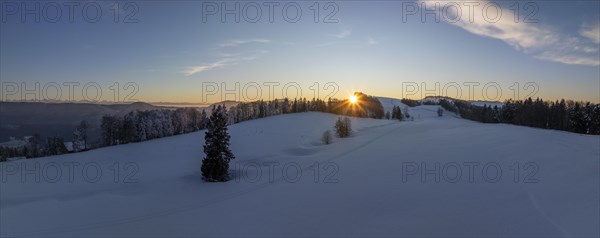 Sunset over the second Jura chain in winter, foreground contours of sinkholes, view towards the first Jura chain with Weissenstein, drone image, Brunnersberg, Solothurn, Switzerland, Europe