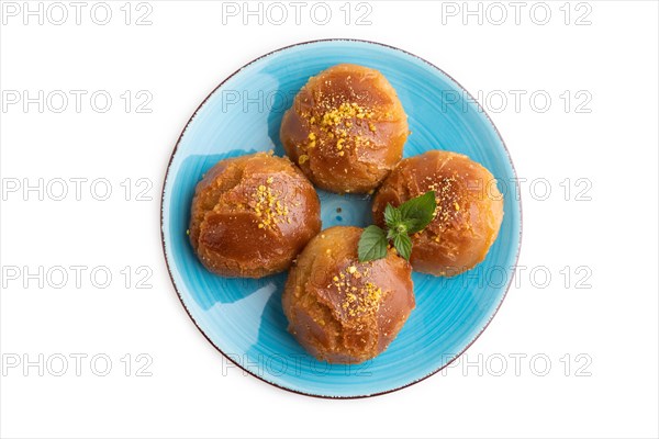 Homemade traditional turkish dessert sekerpare with almonds and honey isolated on white background. top view, flat lay, close up