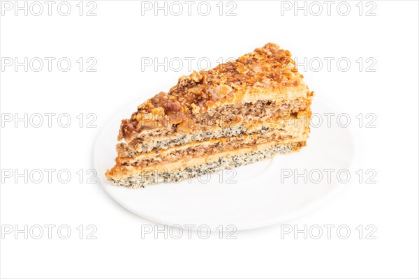 Walnut and hazelnut cake with caramel cream isolated on white background. side view