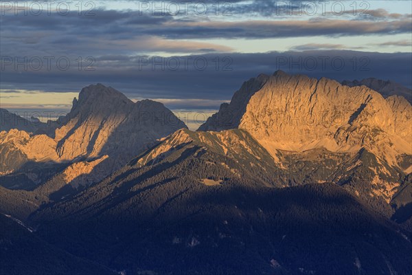 Distant view of steep mountains in the evening light, clouds, autumn, view from Wank to Karwendel Mountains, Werdenfelser Land, Upper Bavaria, Bavaria, Germany, Europe