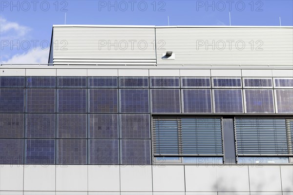 Photovoltaic modules on industrial building, Freiburg, Baden-Wuerttemberg, Germany, Europe