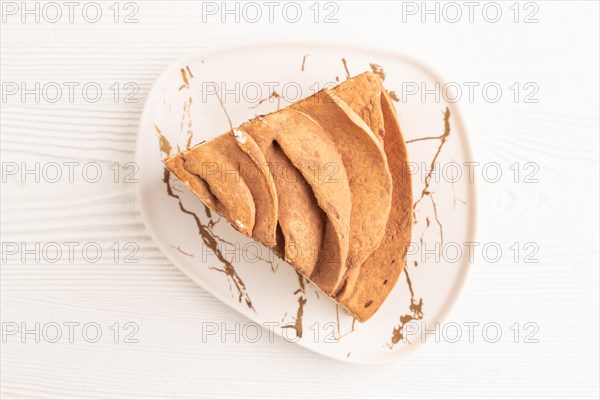 Zephyr or marshmallow cake on white wooden background. top view, flat lay, close up