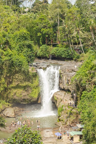 Tegenungan waterfall, Bali island, Ubud, Indonesia. Jungle, tropical forest, daytime with cloudy sky