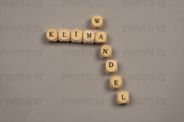 Cubes with letters form the word climate change, light background, top view, studio shot, Germany, Europe
