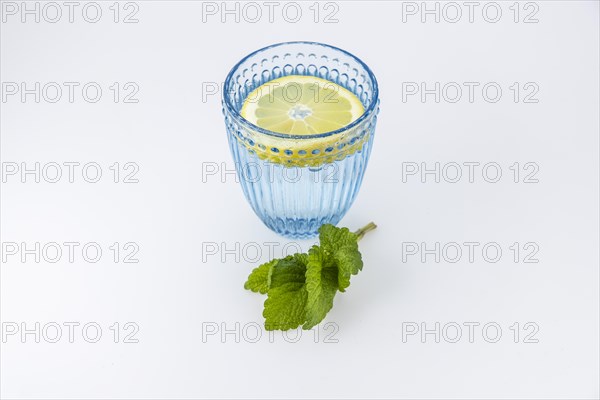 Food photography glass of water with lemon