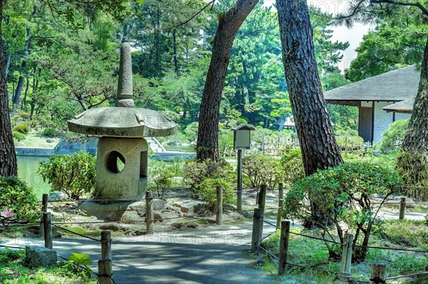 Large stone lantern in Shukkeien gardens in Hiroshima, Japan, Asia
