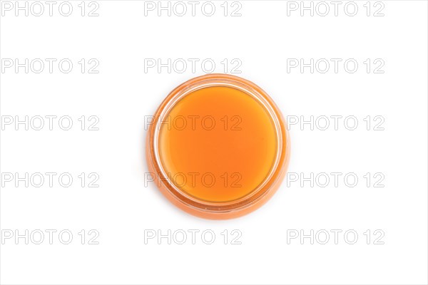 Baby puree with fruits mix, pumpkin, persimmon, mango infant formula in glass jar isolated on white background. Top view, flat lay, close up, artificial feeding concept