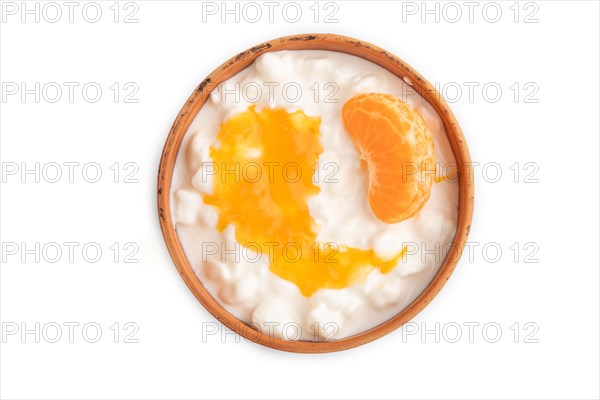 Grained cottage cheese with tangerine jam isolated on white background. top view, flat lay