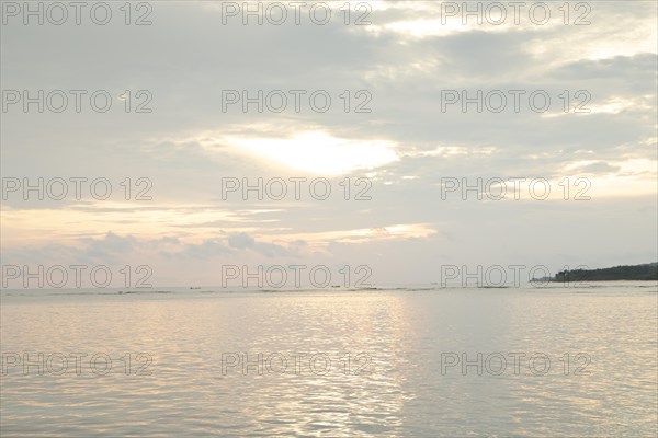 Lombok and Gili Air islands, overcast, cloudy day, sky and sea. Vacation, travel, tropics concept, no people. Sunset, sand beach