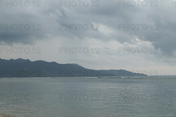 Lombok and Gili Air islands, overcast, cloudy day, sky and sea. Vacation, travel, tropics concept, no people. Sunset, sand beach