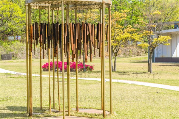 Sculpture: Wind chimes of rusted metal pipes at DMZ Peace Park. Artist unknown in Goseong, South Korea, Asia