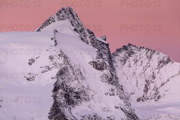 Snow-covered mountain peak at dawn, Grossglockner, Hohe Tauern National Park, Carinthia, Austria, Europe