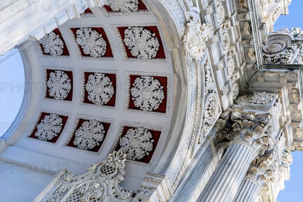 Istanbul, Tuerkiye: Sept. 15, 2022: Perspective view of artwork at top of arch entrance to Dolmabahce Palace in Istanbul, Tuerkiye