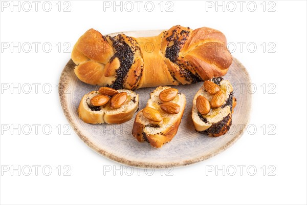 Homemade sweet bun with honey almonds isolated on a white background. side view, close up