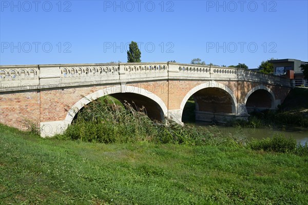 A brick arch bridge over a small river in the countryside under a clear blue sky, Baroque Art Nouveau bridge, Black Water, Cierna voda, Royal Silk, Kralova pri Senci, Bratislavsky kraj, Slovakia, Europe