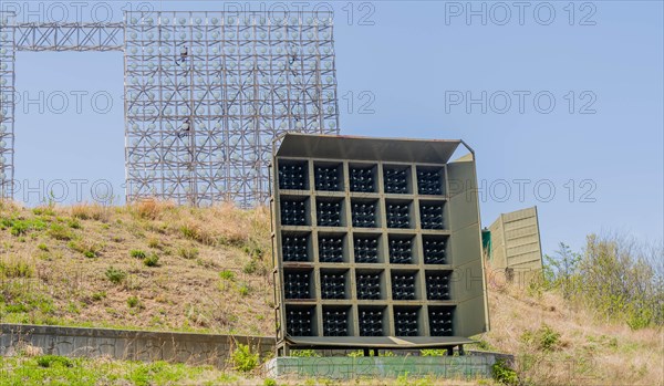 Military array of loud speakers and spot lights on hill overlooking DMZ observation area in Goseong, South Korea, Asia