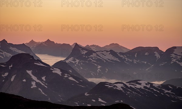 Mountain panorama, mountain peaks in soft light at sunset, view from the summit of Skala, Loen, Norway, Europe