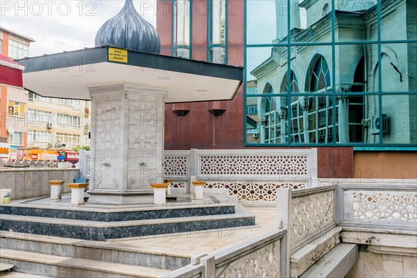 Public ablution fountain in courtyard of urban mosque in Istanbul, Turkiye