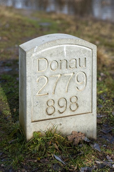 Marker stone at the confluence of the Breg and Brigach rivers to form the Danube, source of the Danube, Donaueschingen, Baden-Wuerttemberg, Germany, Europe