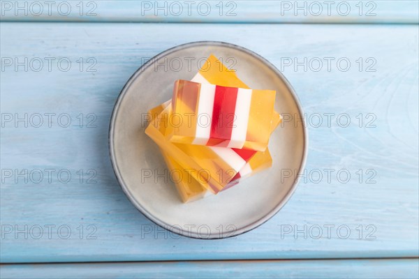 Almond milk and peach jelly on blue wooden background. top view, flat lay, copy space