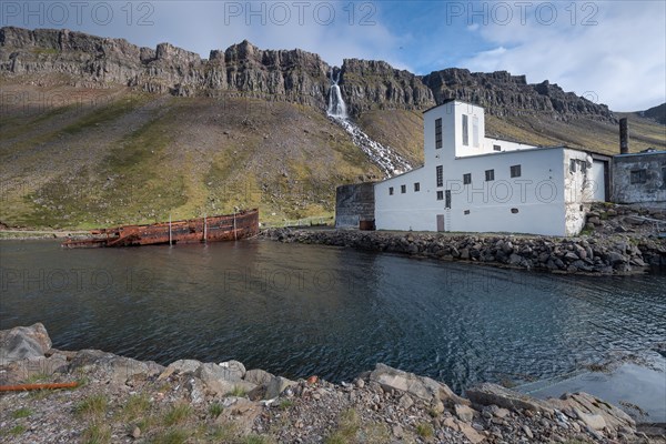 Baejararfoss waterfall, shipwreck, abandoned herring factory Djupavik, Reykjarfjoerour, Strandir, Arnes, Westfjords, Iceland, Europe