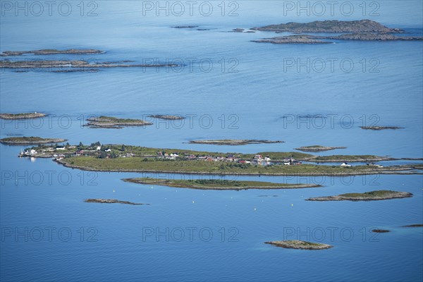 Rocky islands with colourful houses, sea with archipelago islands, Ulvagsundet, Vesteralen, Norway, Europe