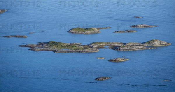 Rocky islands in the blue sea, sea with archipelago islands, Ulvagsundet, Vesteralen, Norway, Europe