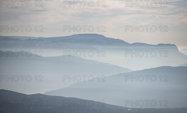 Mountain silhouettes in the evening light, view from the summit of Skala, Loen, Norway, Europe