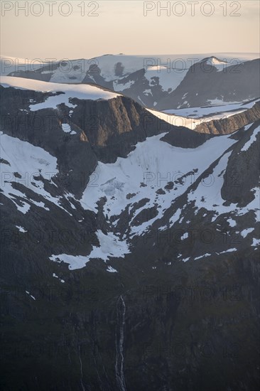 Mountain peak with Jostedalsbreen glacier in the evening light, view from the summit of Skala, Loen, Norway, Europe