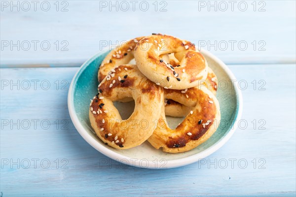 Homemade asian salted cookies, on blue wooden background. side view, close up