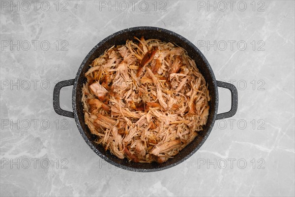 Top view of pulled pork in a large pan