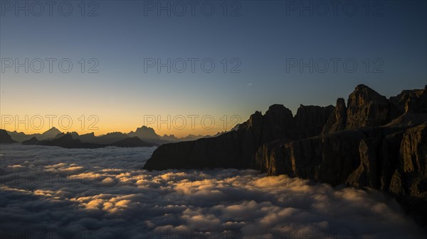 Sunrise over a sea of fog and Dolomite peaks in the background, Corvara, Dolomites, Italy, Europe