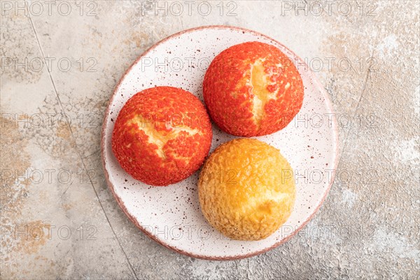 Traditional french custard dessert shu cake on brown concrete background. top view, flat lay, close up. Breakfast, morning, concept