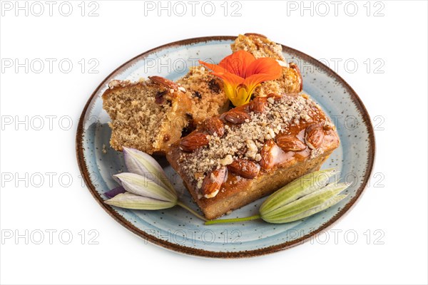 Caramel and almond cake isolated on white background. side view, close up