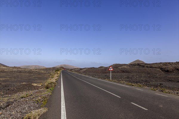 Road through lava fields, volcanic landscape, Lanzarote, Canary Islands, Canary Islands, Spain, Europe