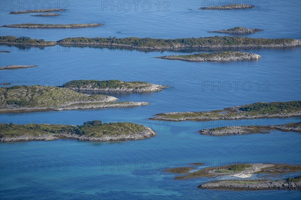 Rocky islands in the blue sea, Sea with archipelago islands, Vesteralen, Norway, Europe