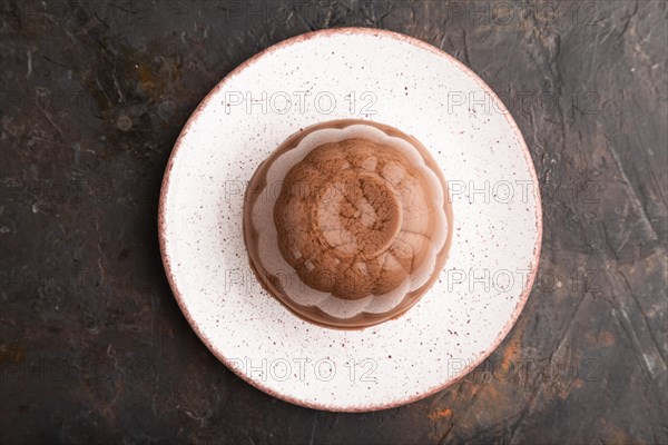 Chocolate jelly on black concrete background. top view, flat lay