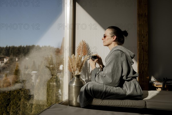 Woman enjoying coffee at a wellness centre