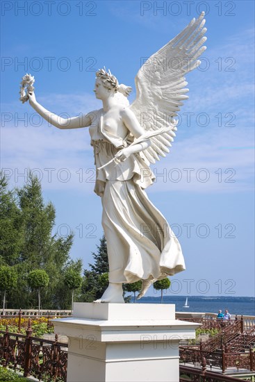 One of two sculptures, white statues, figures Floating Victorians (Angel of Peace, Goddess of Victory) by Christian Daniel Rauch, terrace at the main tower, Schwerin Castle, castle garden, in the background Schwerin's inner lake, angel with feather, goddess, bare-breasted, Schwerin, Mecklenburg-Western Pomerania, Germany, Europe