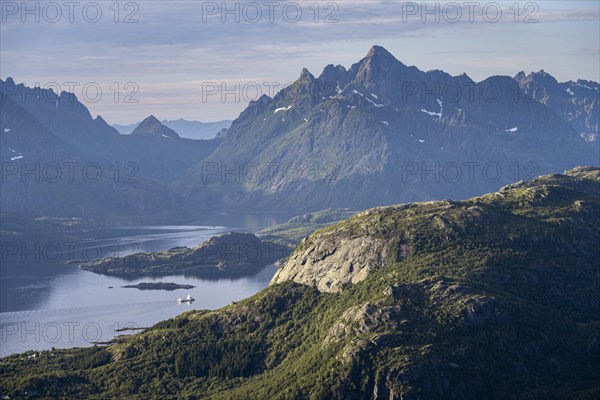 Fjord Raftsund and mountains in atmospheric evening light, view from the summit of Dronningsvarden or Stortinden, Vesteralen, Norway, Europe