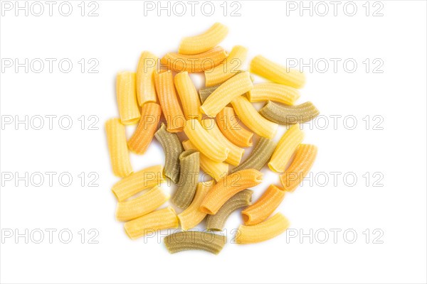 Rigatoni colored raw pasta isolated on white background. Top view, flat lay