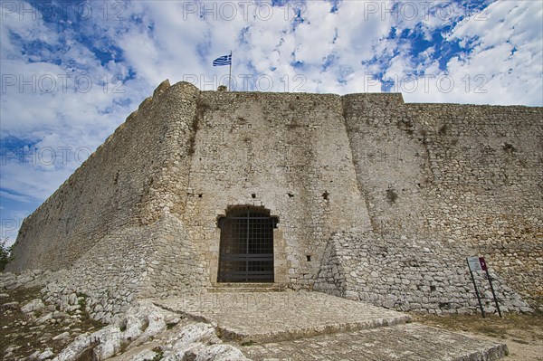 Fortress with Greek flag on a cloudy day, Chlemoutsi, High Medieval Crusader Castle, Kyllini Peninsula, Peloponnese, Greece, Europe