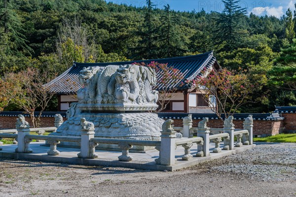 Stone carved dragons atop turtle at Buddhist temple in Gimje-si, South Korea, Asia