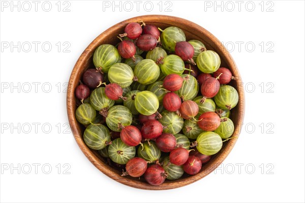 Fresh red and green gooseberry in wooden bowl isolated on white background. top view, flat lay, close up